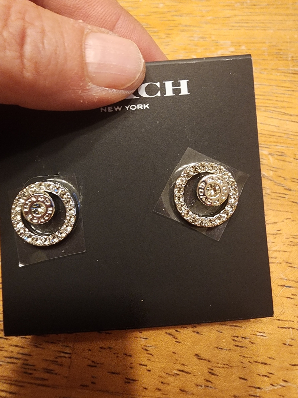 Coach Open Circle Pave Halo Stud Earrings featuring a crystal-embellished halo